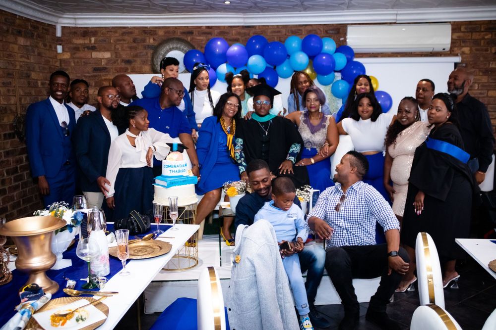 Graduation shoot, with family gathering together to celebrate their sons graduation.