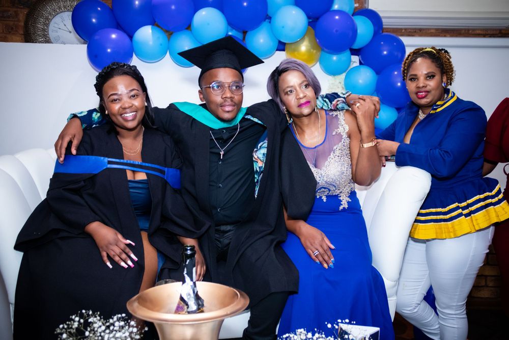 Graduation shoot, with family gathering together to celebrate their sons graduation.