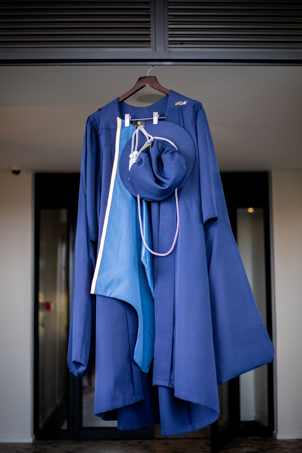 Graduation photography, graduation shoot with a degree certificate, wearing gowns and holding their degrees. Graudation outfit.
