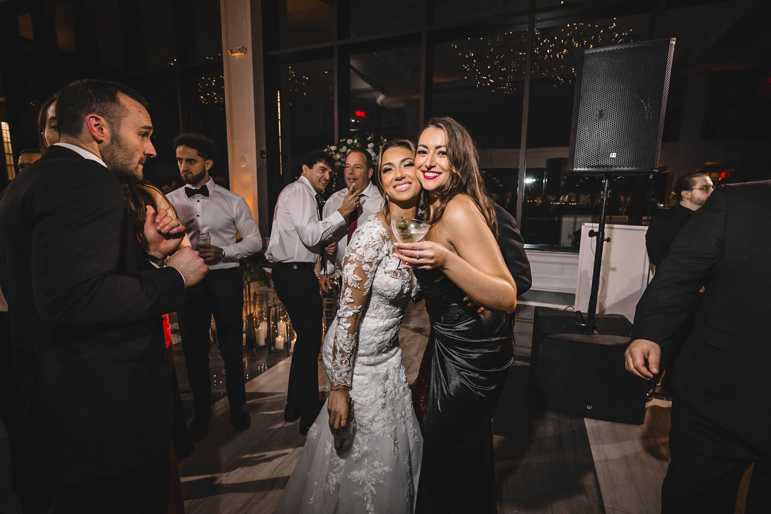 Wedding celebration with guests dancing and enjoying the festive atmosphere.