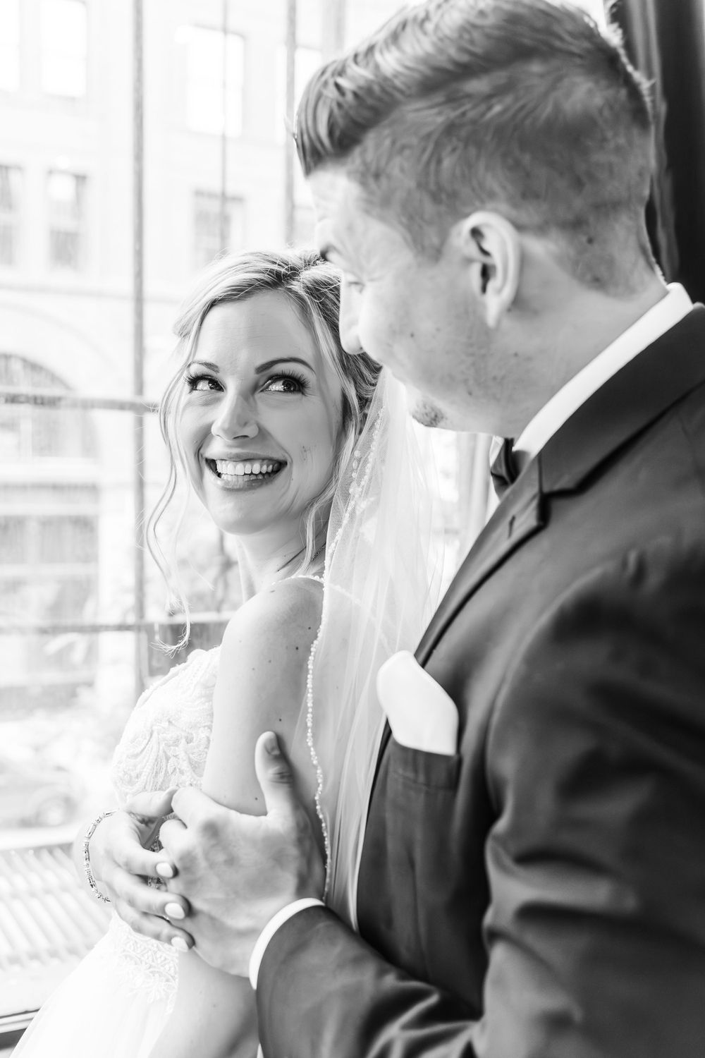 Intimate moment captured between couple during their first look wedding photos.