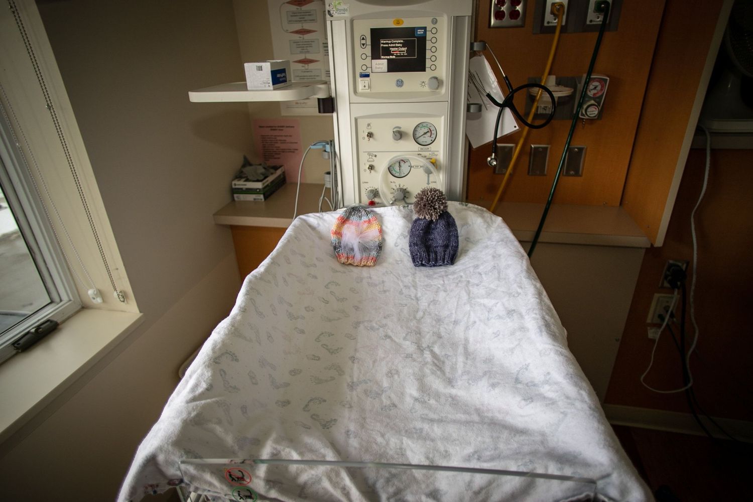 Newborn hats, one for a boy and one for a girl, in a warmer at UnityPoint Health in Sioux City, IA.