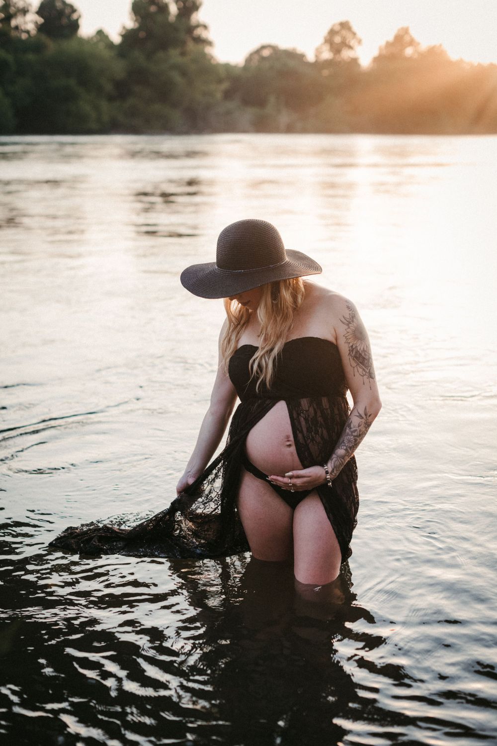 Silhouette photos at sunset of figure wearing wide brim hat in lake water at Seven Islands State Birding Park.