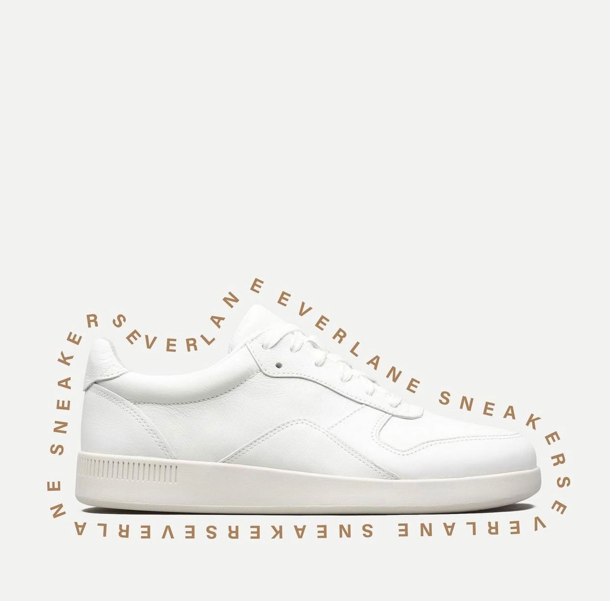 White minimalist sneaker with circular text design around it on white background.