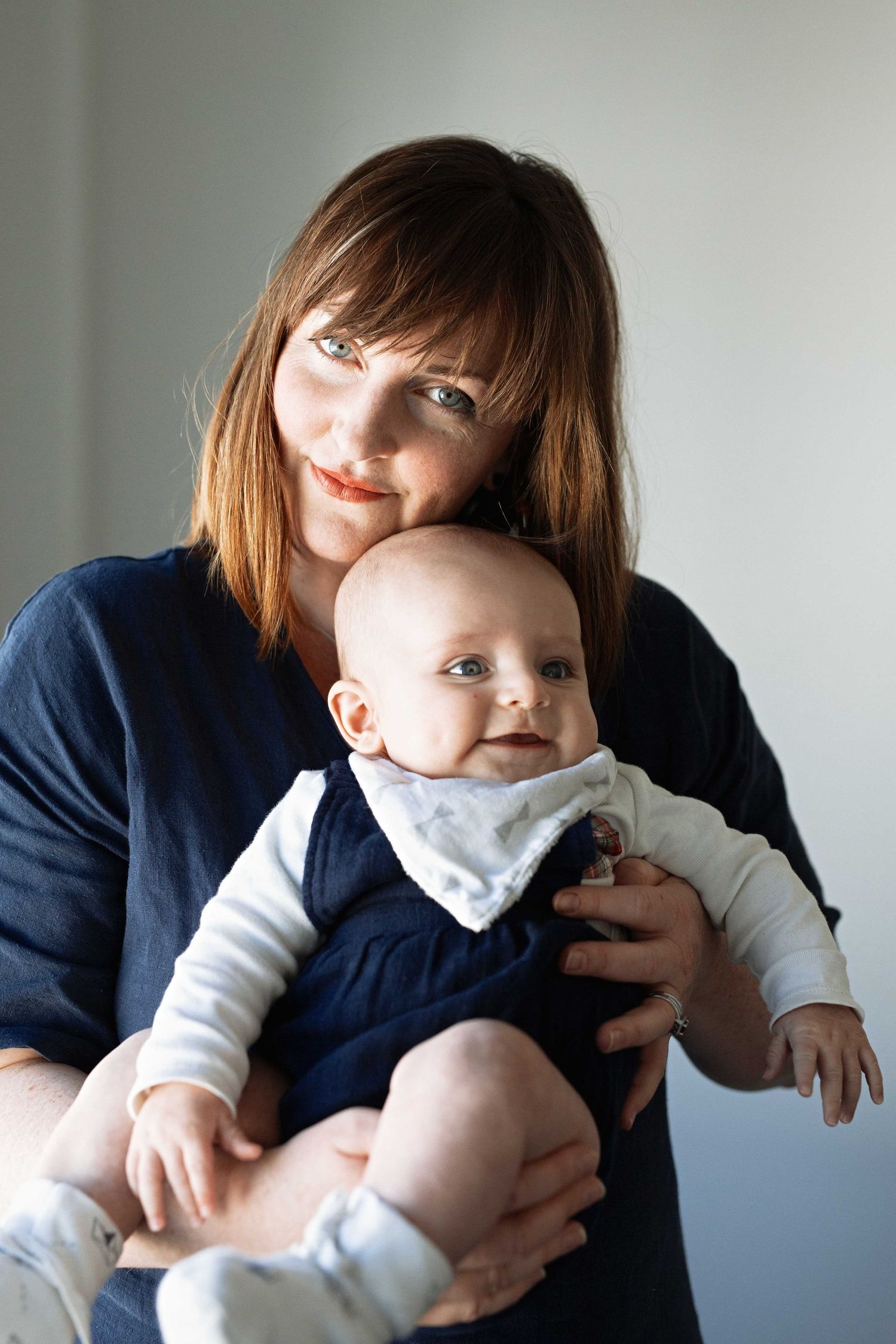 Rebecca McMillan photographed holding baby Charlie, photo by Victoria Vincent