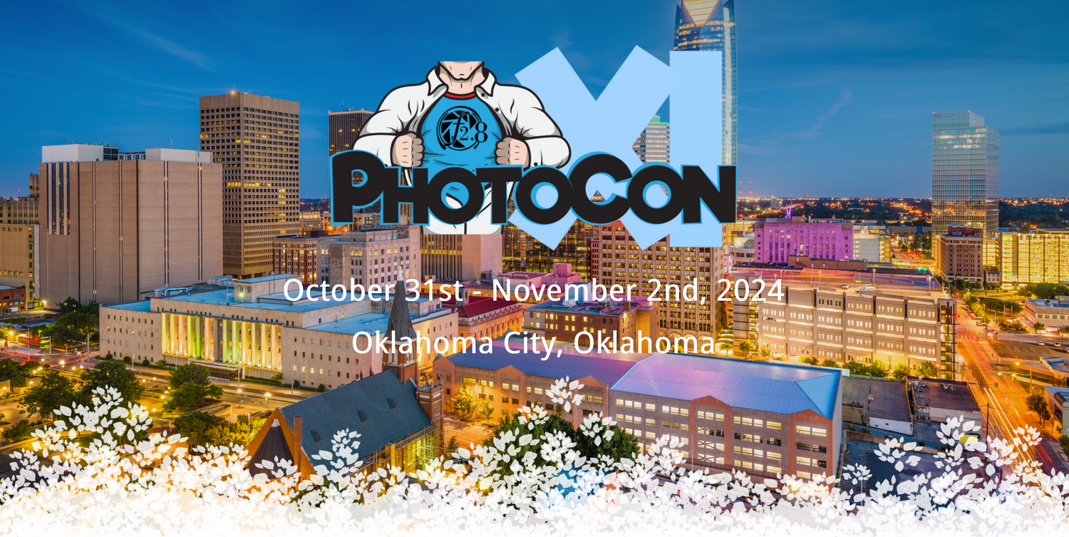 Oklahoma City cityscape at dusk with PhotoCon XI logo over the top which has a superhero bust opening shirt with F2.8