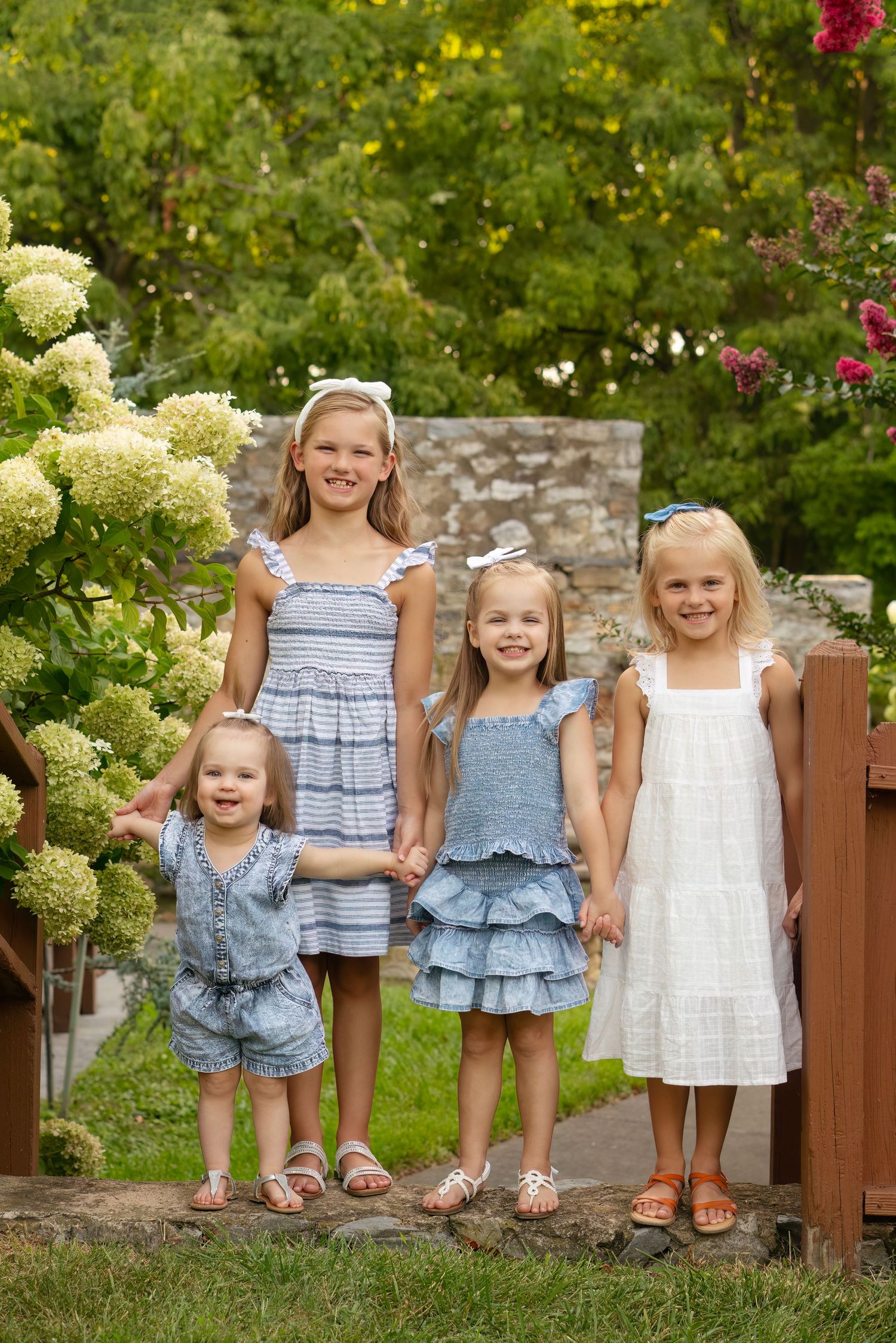 4 sisters smile at park