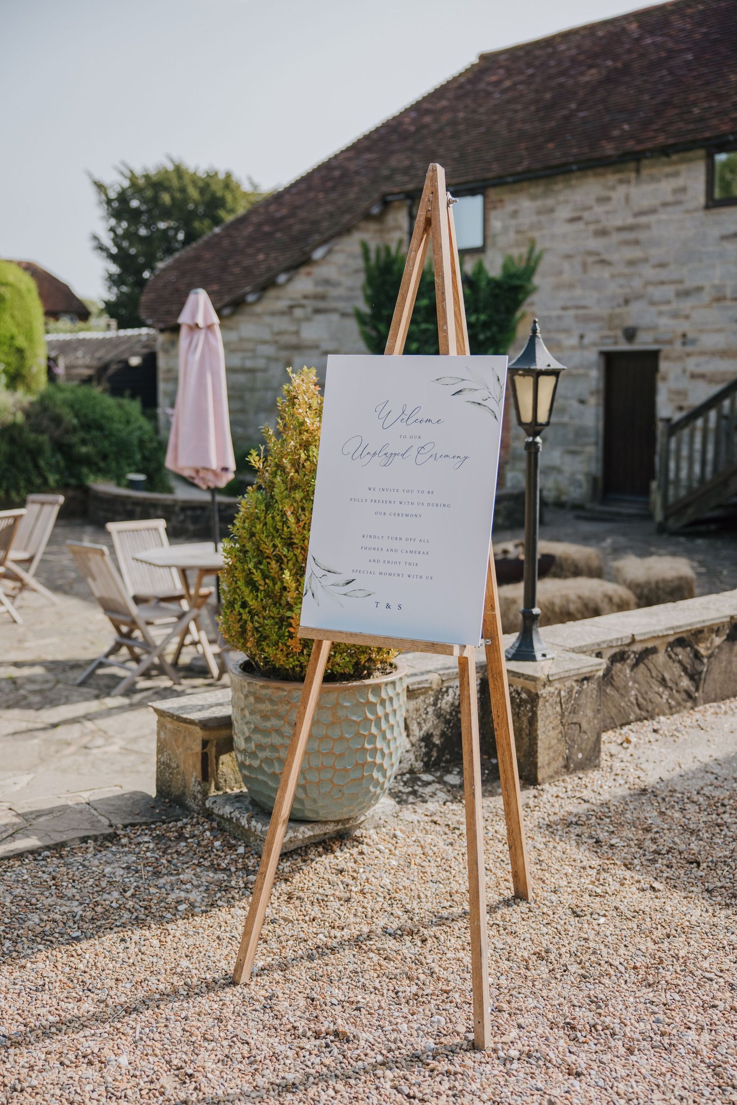wedding sign on an easel at swallows oast east sussex