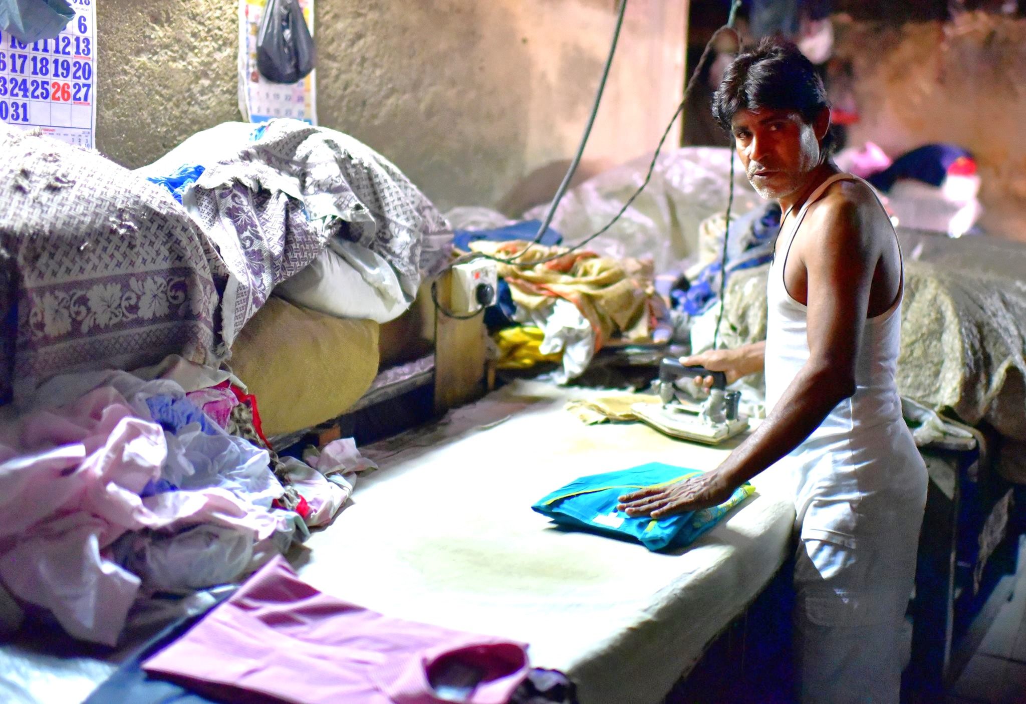 A worker in Dhobi Ghat open air laundry in Mumbai, India.