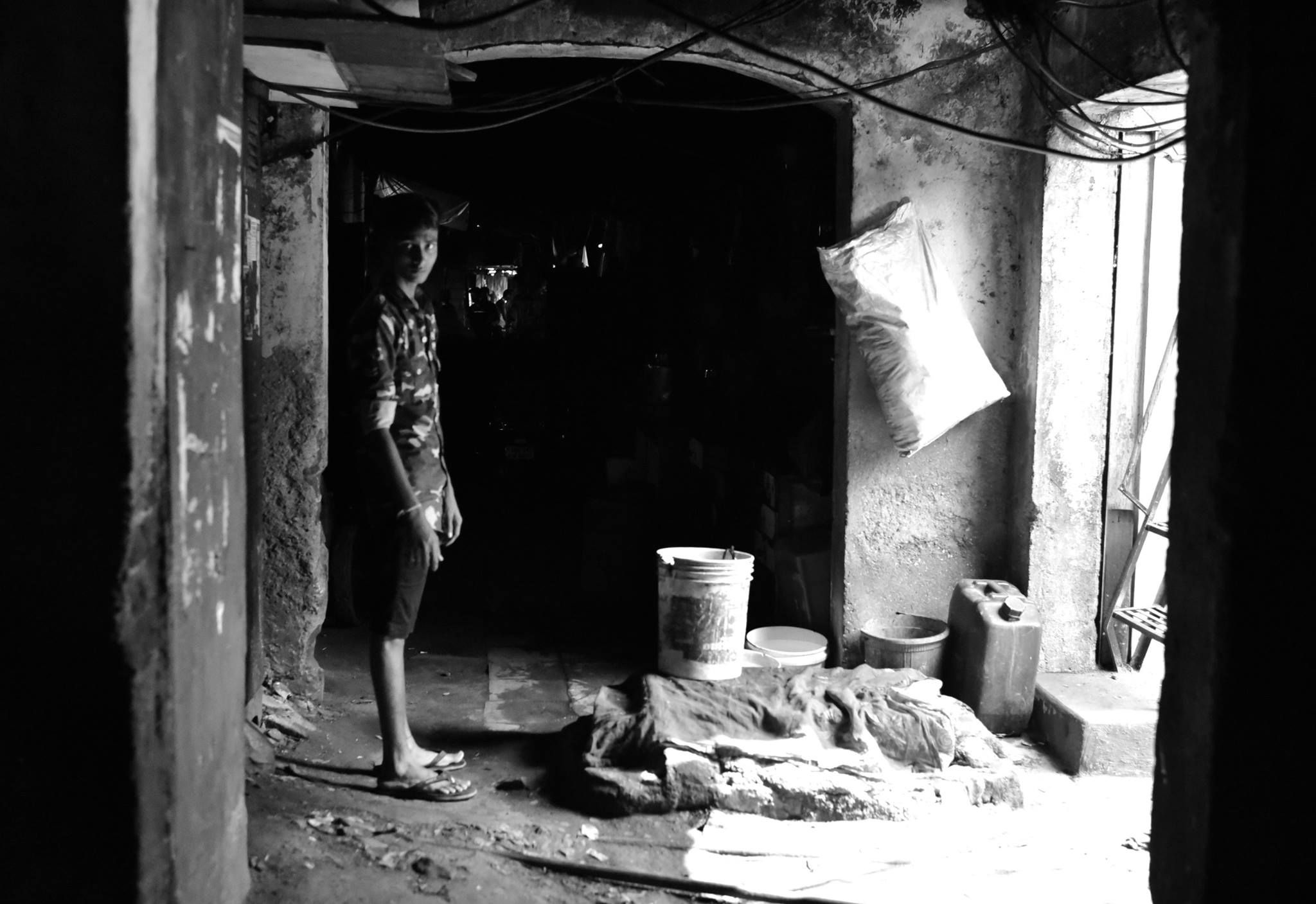 A child worker in Dhobi Ghat open air laundry in Mumbai, India.