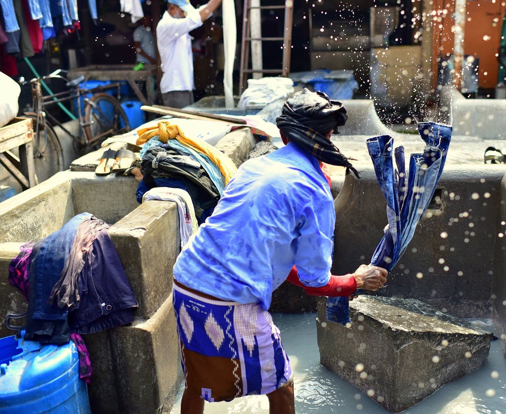 A worker in Dhobi Ghat open air laundry in Mumbai, India.
