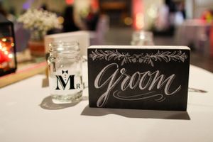 Black chalkboard wedding signs with elegant calligraphy for bride and groom.