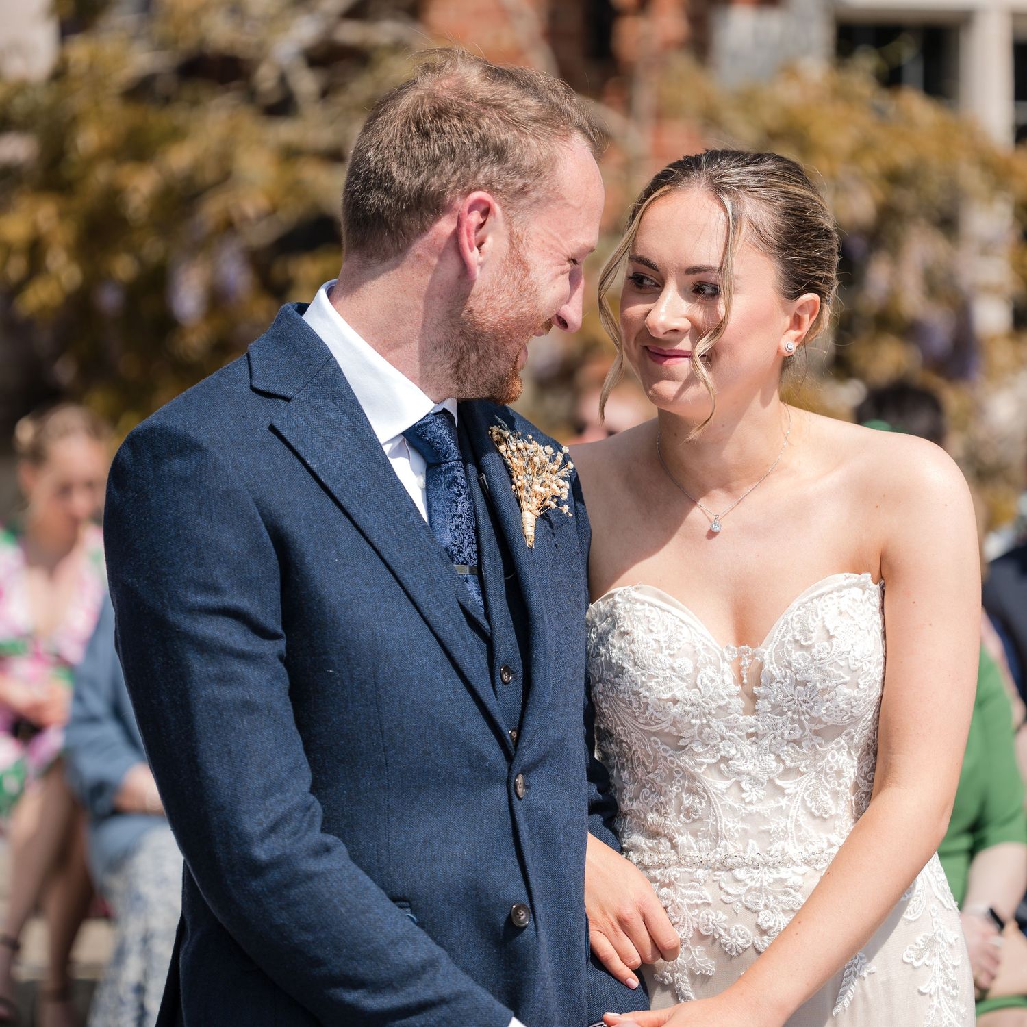 Bride and Groom smiling and embracing during their vows