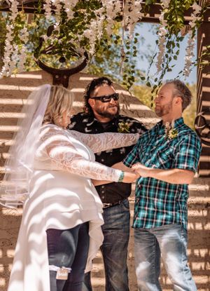 Wedding celebration moment captured under natural lighting and decorative elements.