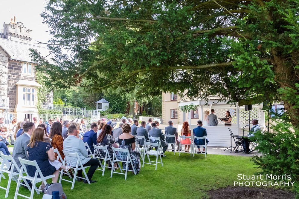 Outdoor wedding ceremony in the gardens at west tower. Lancahisre wedding photographer