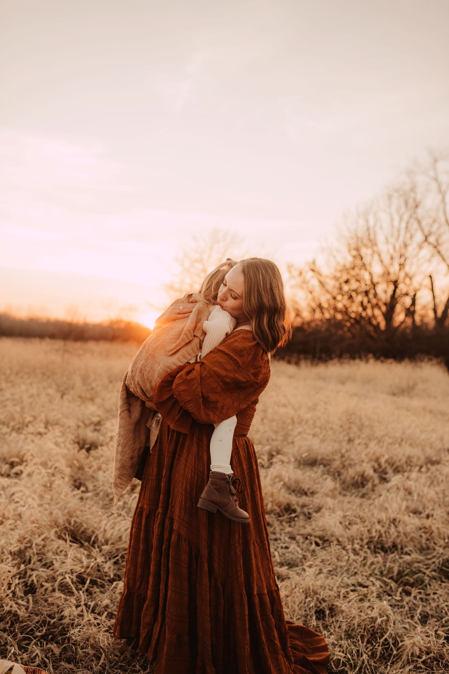 winter time snuggles to keep warm with mom- motherhood photography