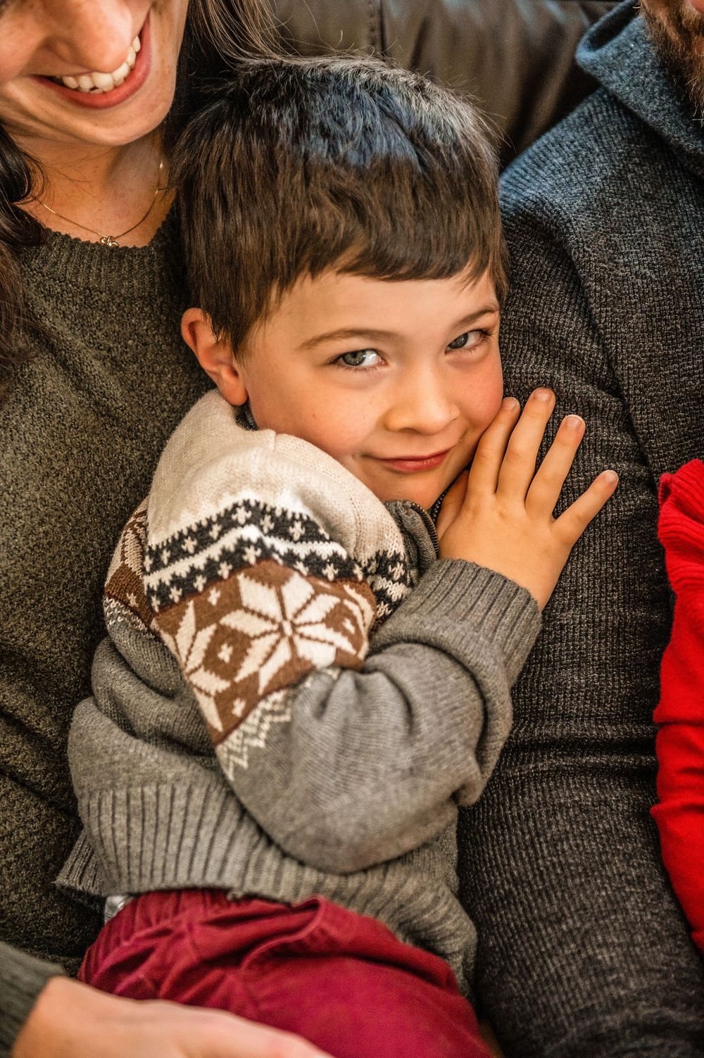 Cozy winter moment wearing festive sweater during holiday season.