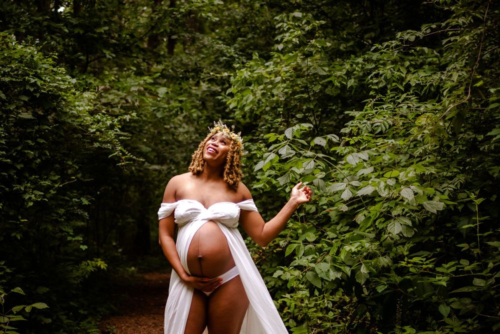 Black woman maternity session, outdoor bridge maternity, ethereal maternity session.