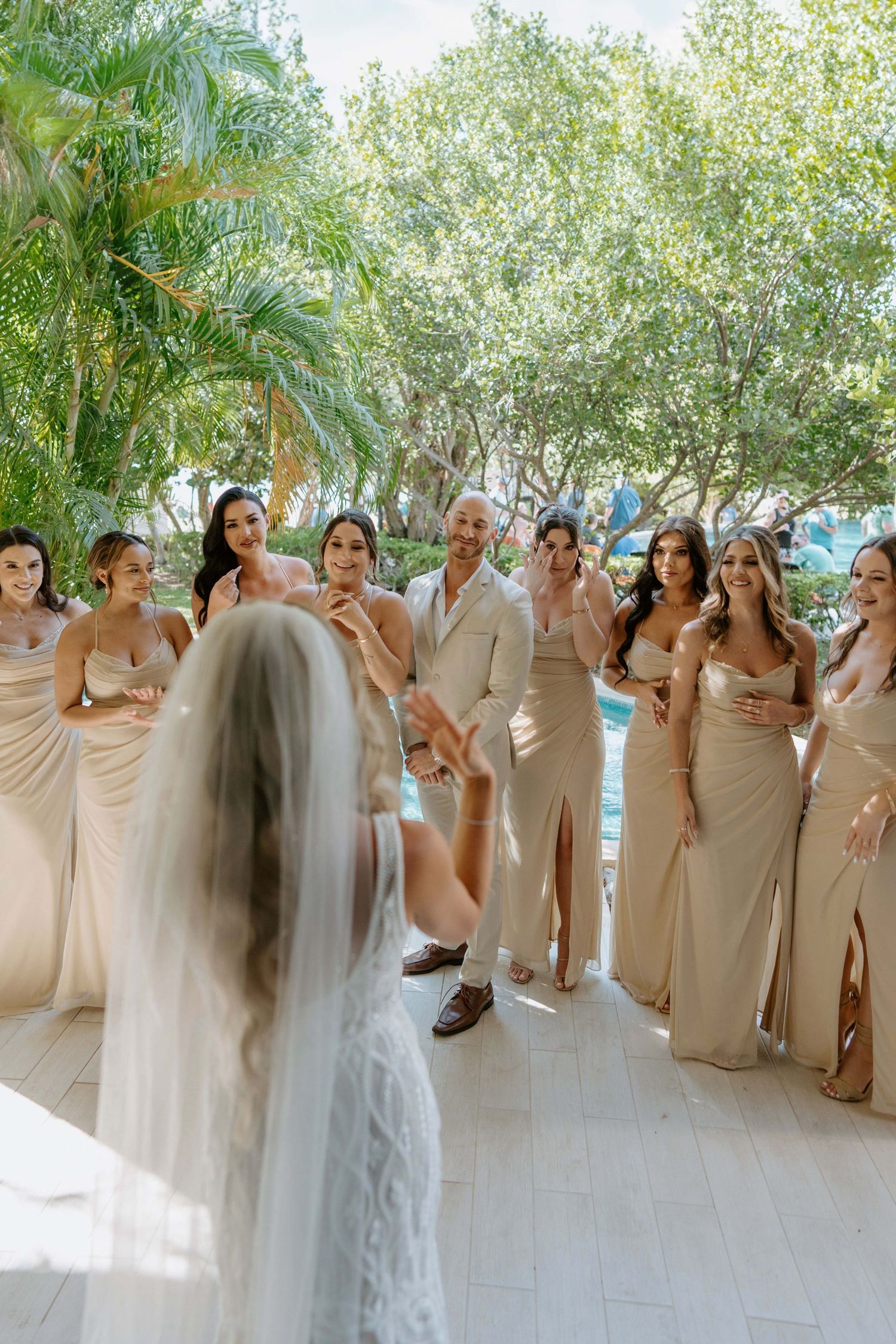Laughter and excitement fill the room as the bride and her bridesmaids share joyous moments while getting ready
