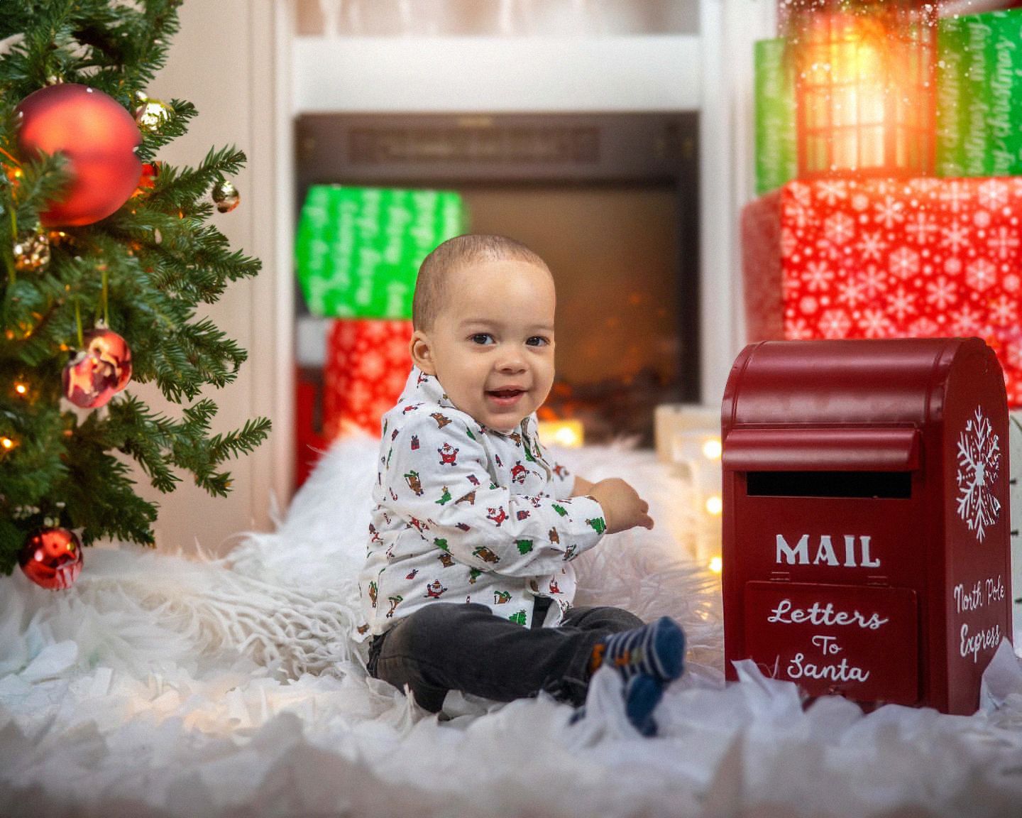 Christmas scene with decorated tree, red mailbox, and snowy white setting.