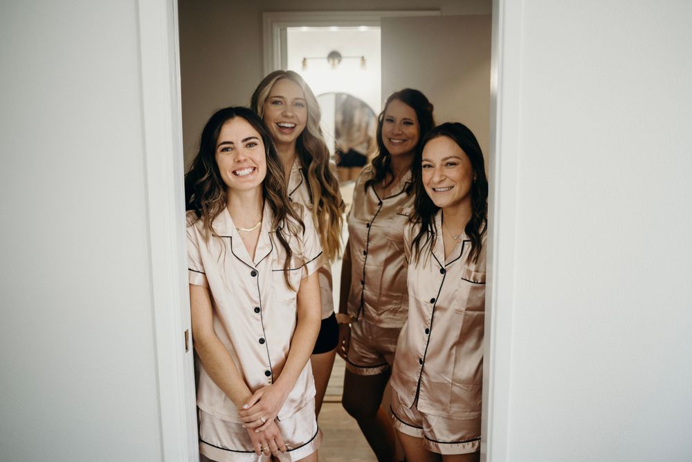 Candid moments of wedding party members sharing laughs in matching outfits.