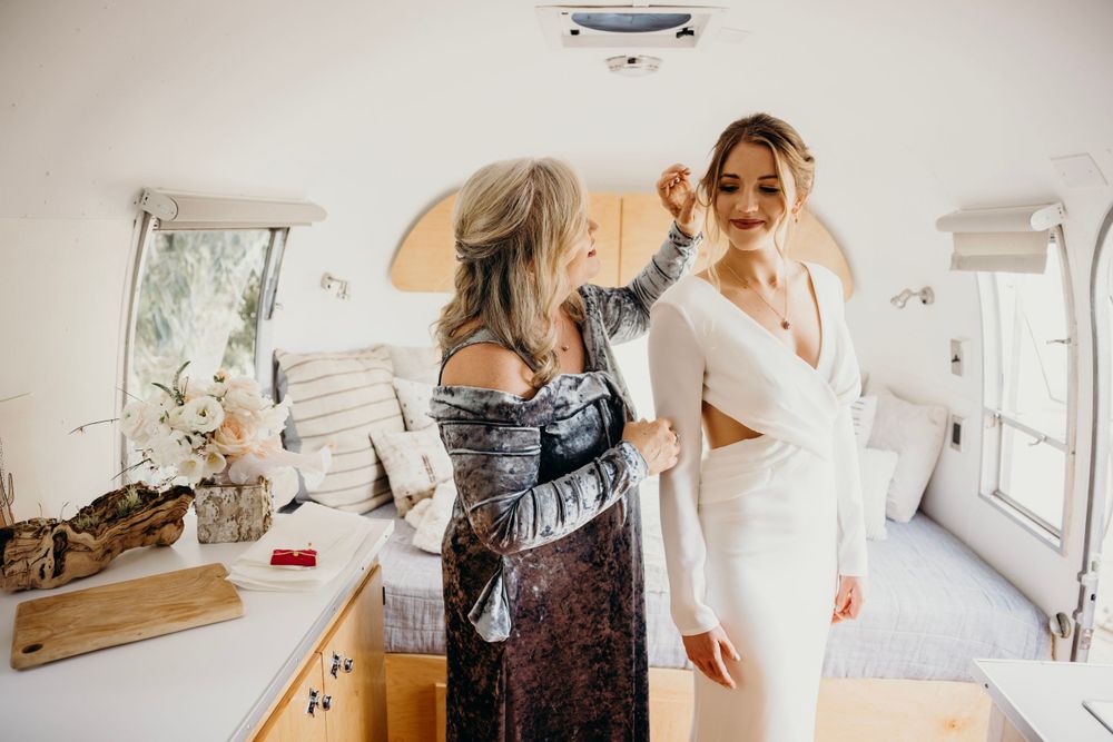 Wedding preparation moments captured in bright, airy indoor setting.
