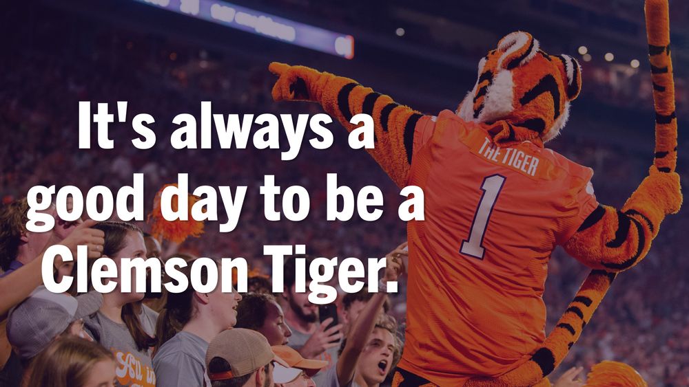 Orange and white motivational message about being a Clemson Tiger against stadium background.