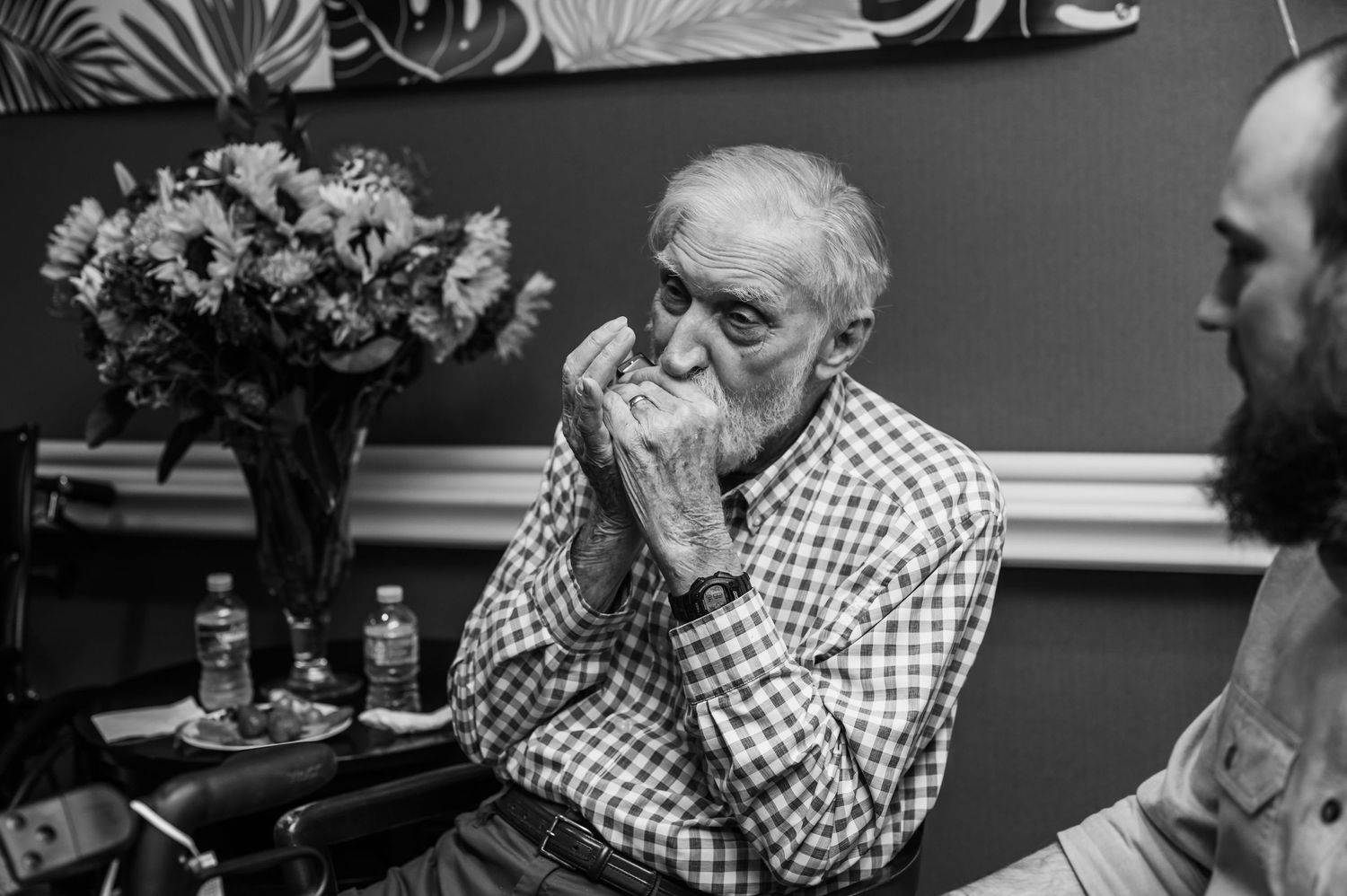 Black and white photo strip showing emotional expressions and laughter in a series of candid moments.