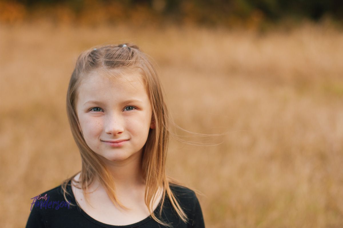 a young in a field photographed by Delta Blossoms Photography in Manila, Arkansas