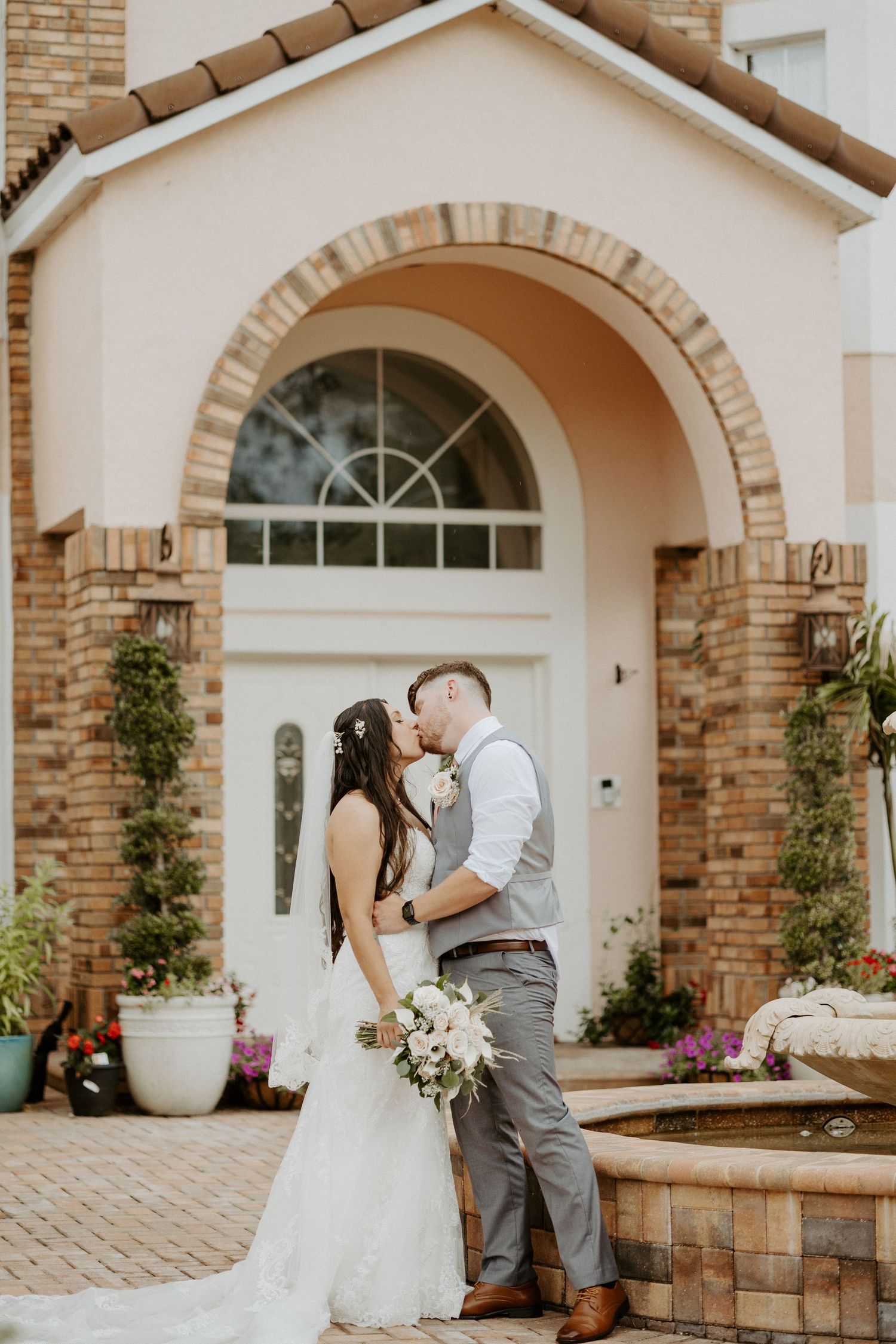 Wedding Couple Posing in front of their beautiful vintage home in Kissimmee Florida