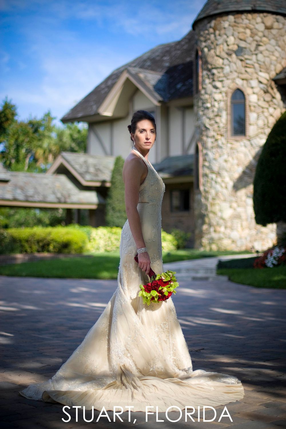 An elegant bridal portrait in front of a stone castle-style building in Stuart, Florida.