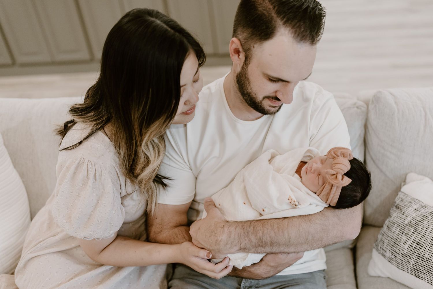 Candid family portrait in Joplin, Missouri captured in natural light by Modern Moods Imagery, showing genuine connection and movement.