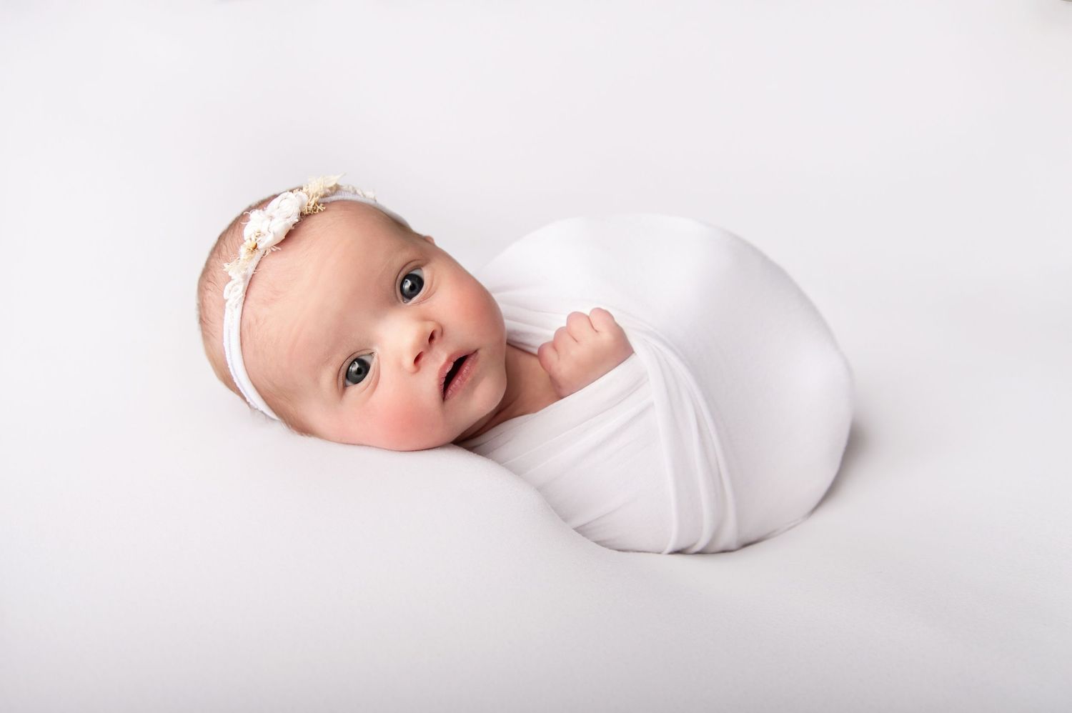 Newborn posing by kara jade photography