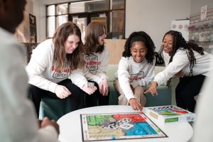 the green photograph commercial photography students playing board game