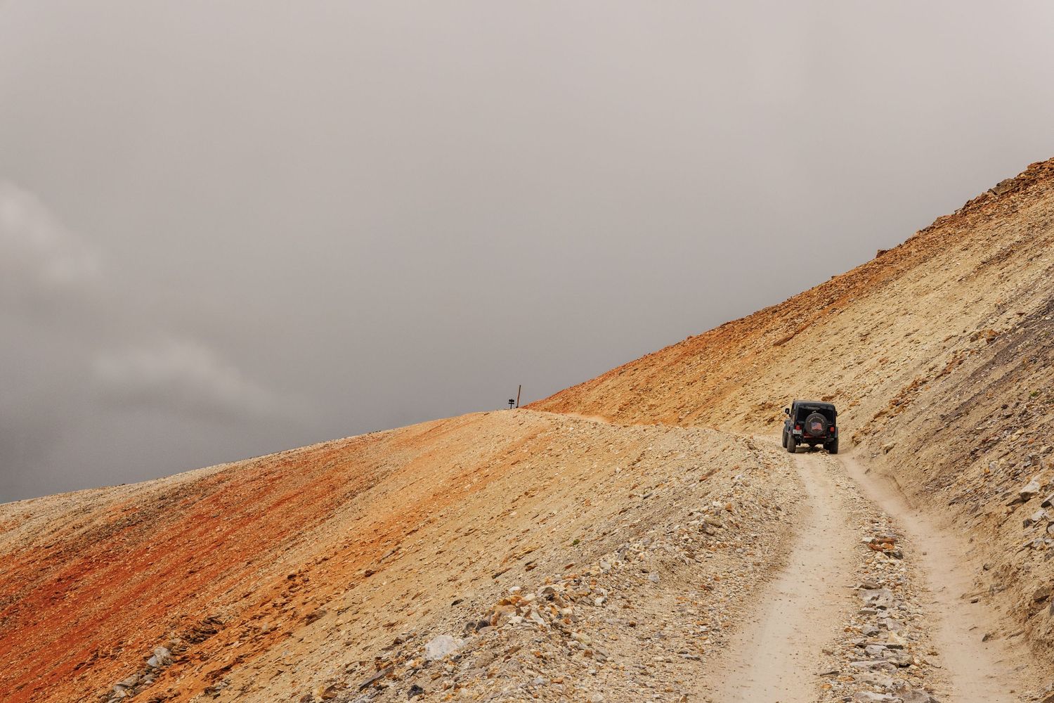Jeep climbing a dirt road in Colorado