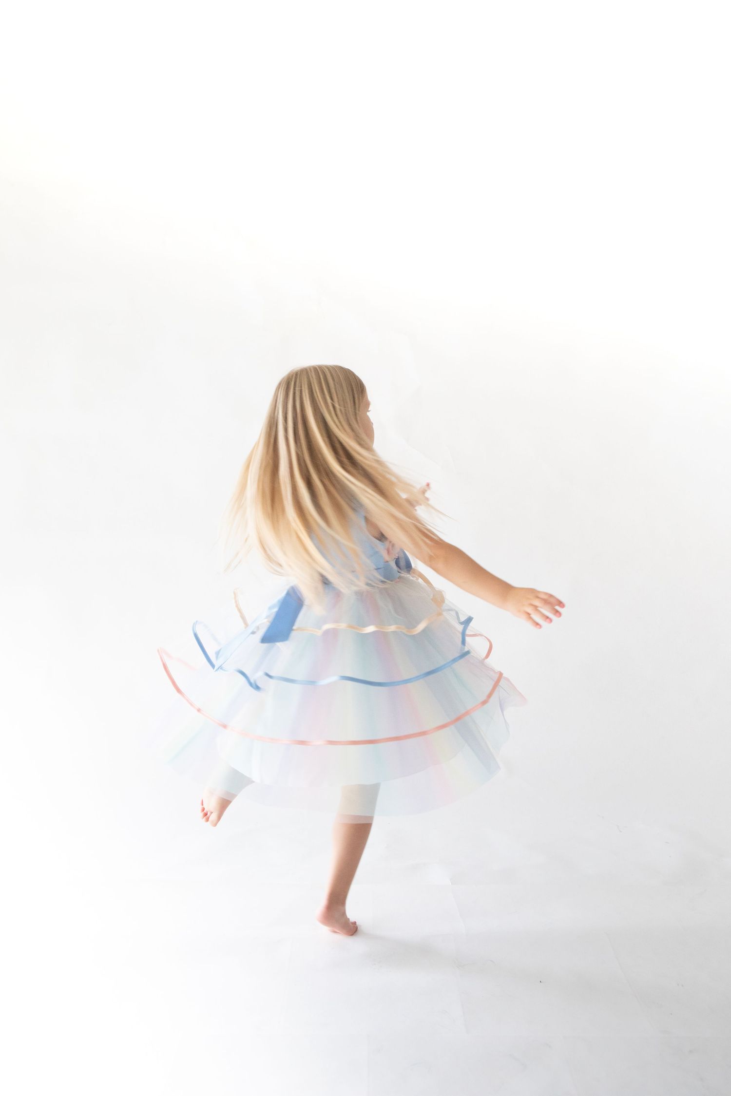 Little girl twirling in her dress