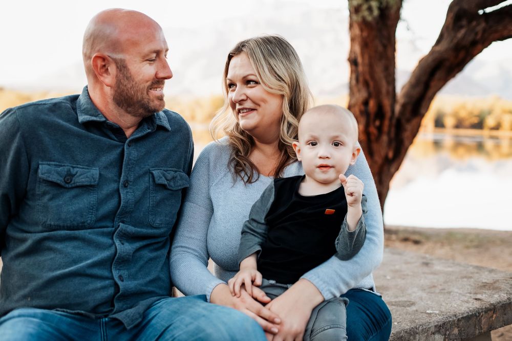 Candid family moments captured against a mountainous desert landscape.