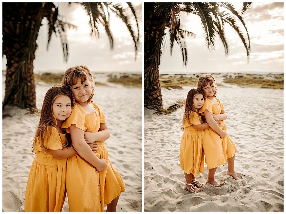 sisters hug each other on the sand at Coronado mini session