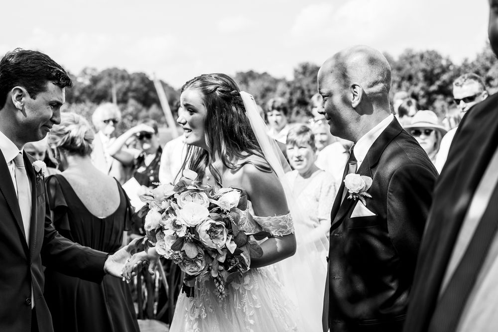 London Wedding Photographer Arrowwwod Farm Bride and Groom First Embrace at Ceremony Spirits Intrigued Photography 2022