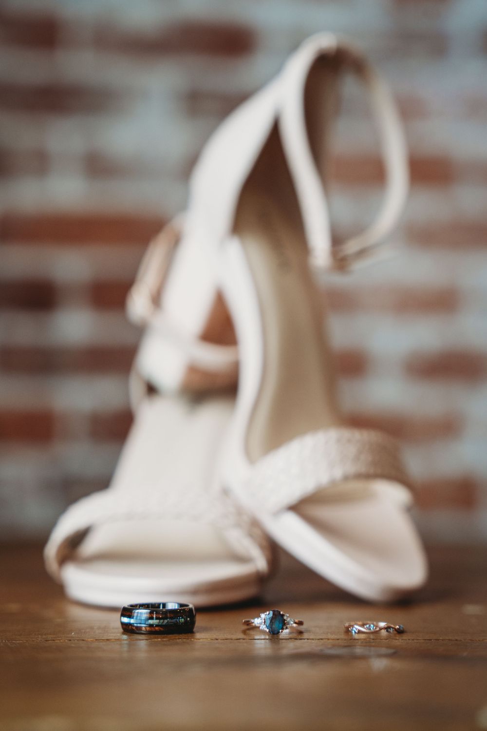 detail photo of wedding shoes and wedding rings