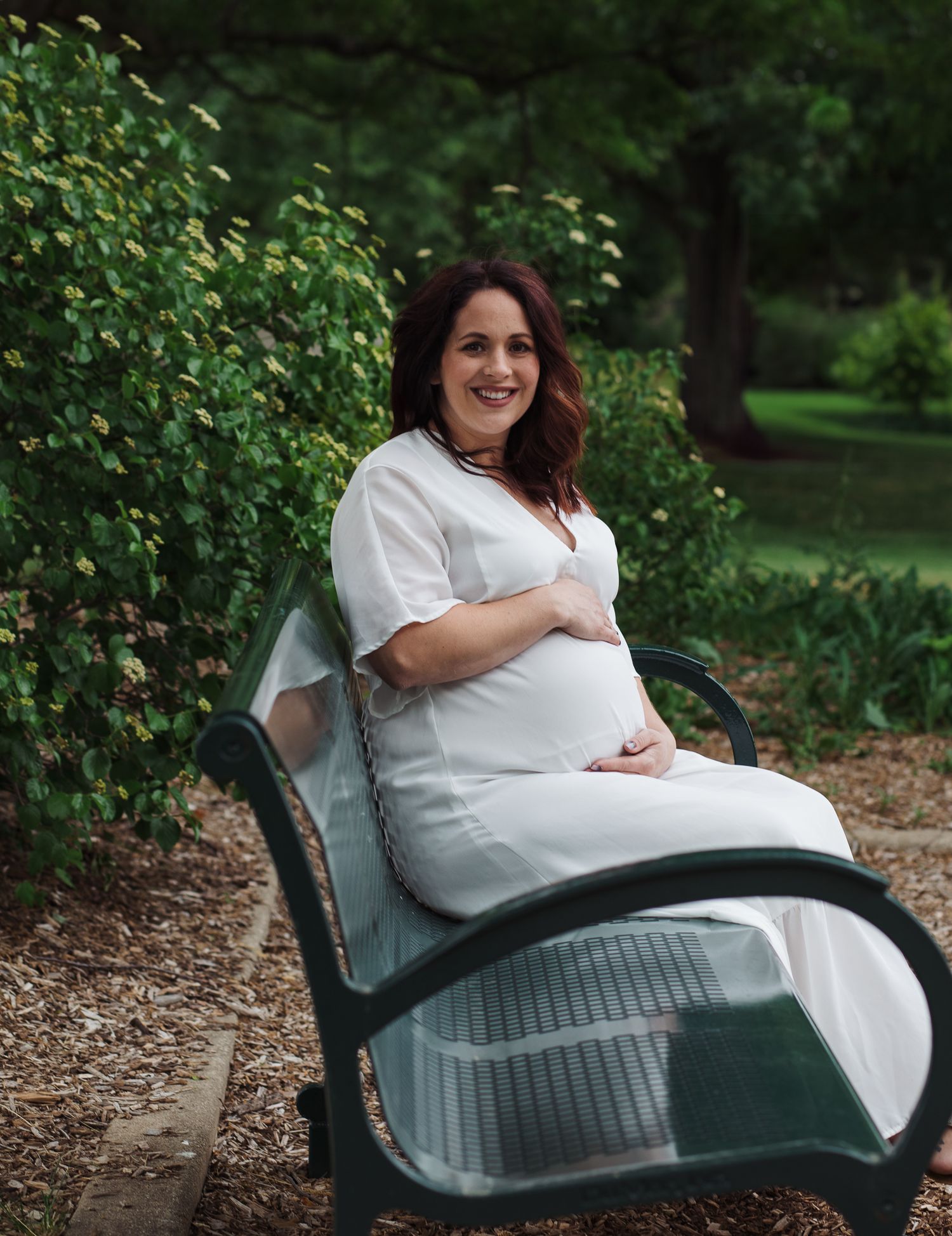maternity photoshoot with white dress at a park in Hanover Park, IL