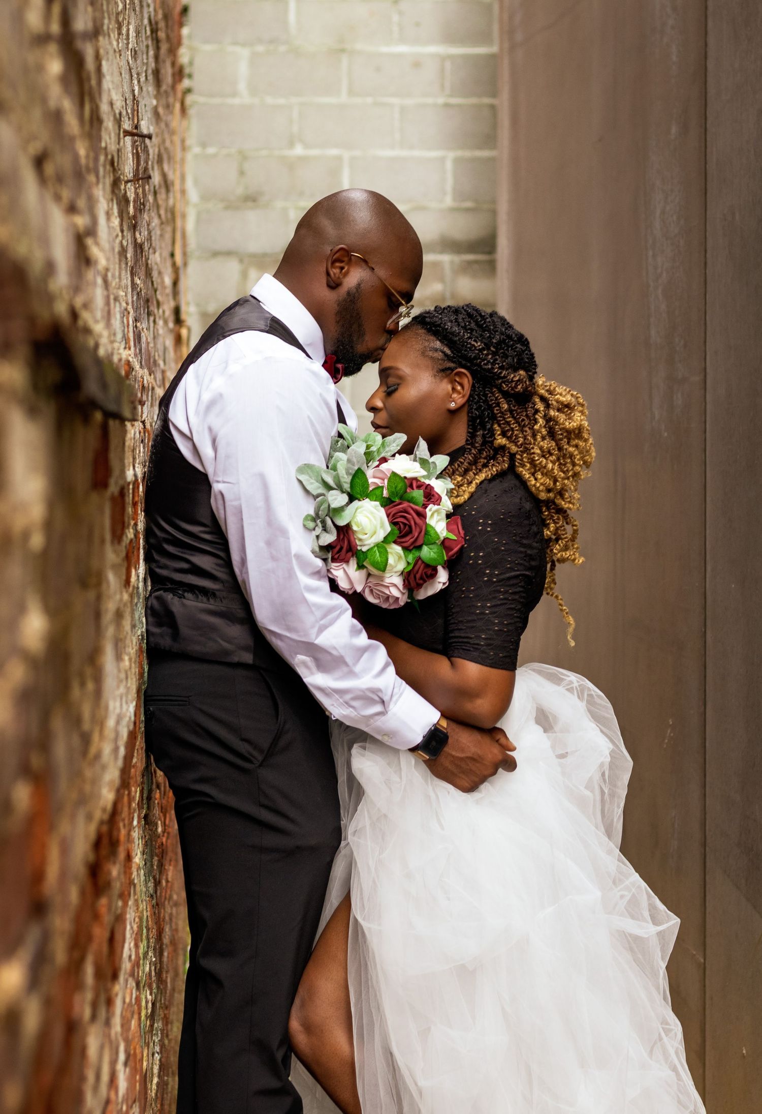 Bride and groom posing for a portrait downtown Montgomery, AL.