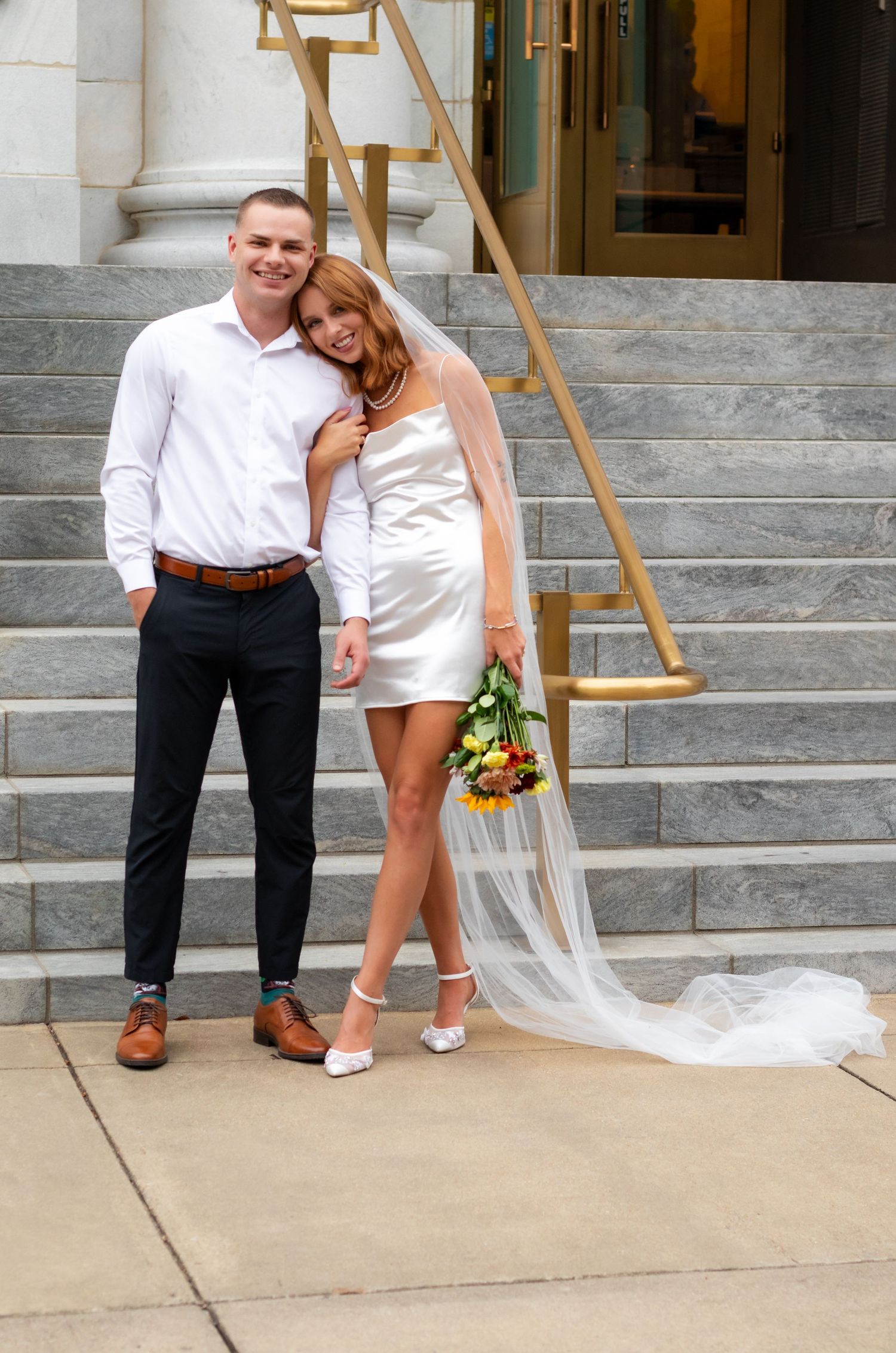 Elopment photos of a recently married couple in front of the courthouse downtown Birmingham, Al.
