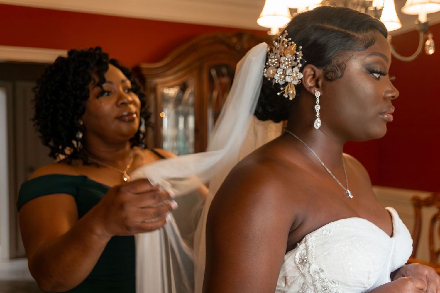 Wedding preparation scene with bridal veil and sparkly hair accessories.
