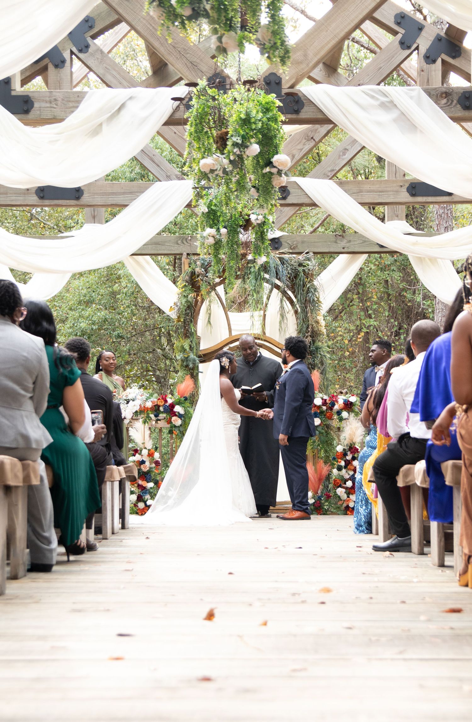 Bride and groom standing at the alter on their wedding day in Mobile, AL.