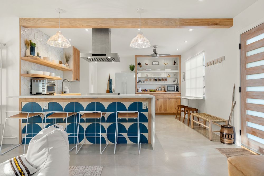 Modern desert home interior features wooden beams, sleek furniture, and a minimalist aesthetic.