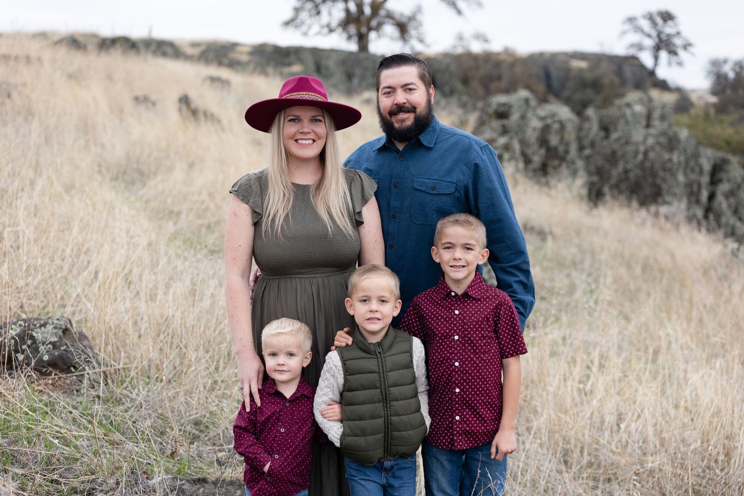 Family portrait Session at Black Butte Lake in Orland, California with golden grass, trees and boulders