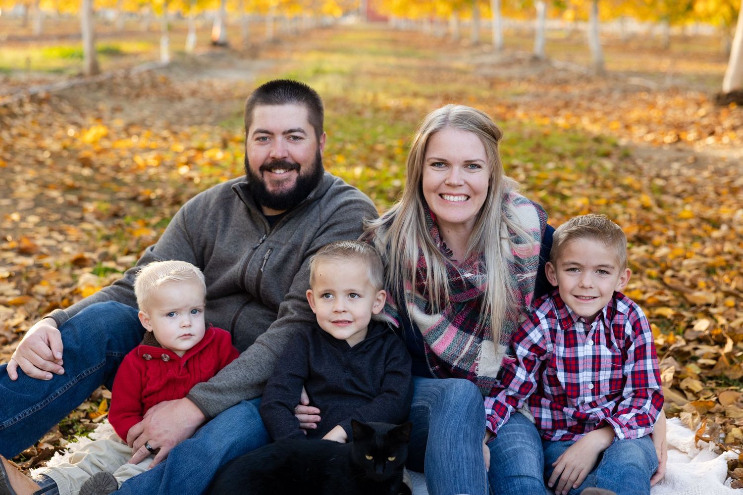 Family portrait session in walnut orchard in orland, california