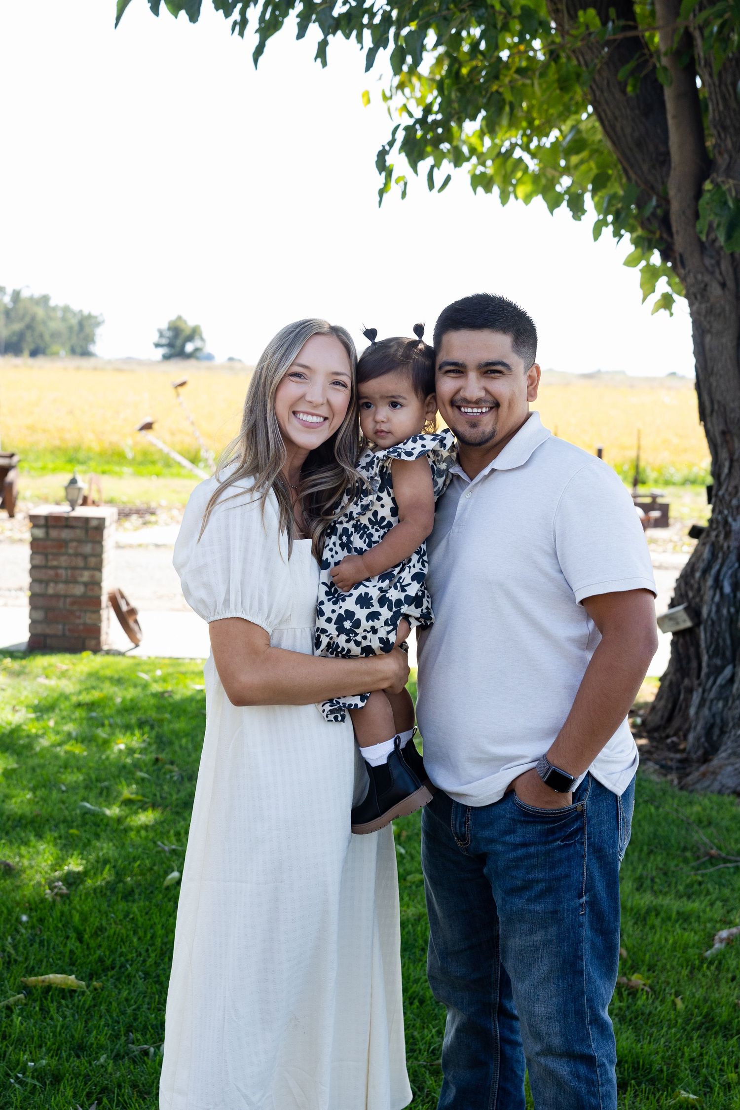 Family portrait session in Willows, California with rice field behind them