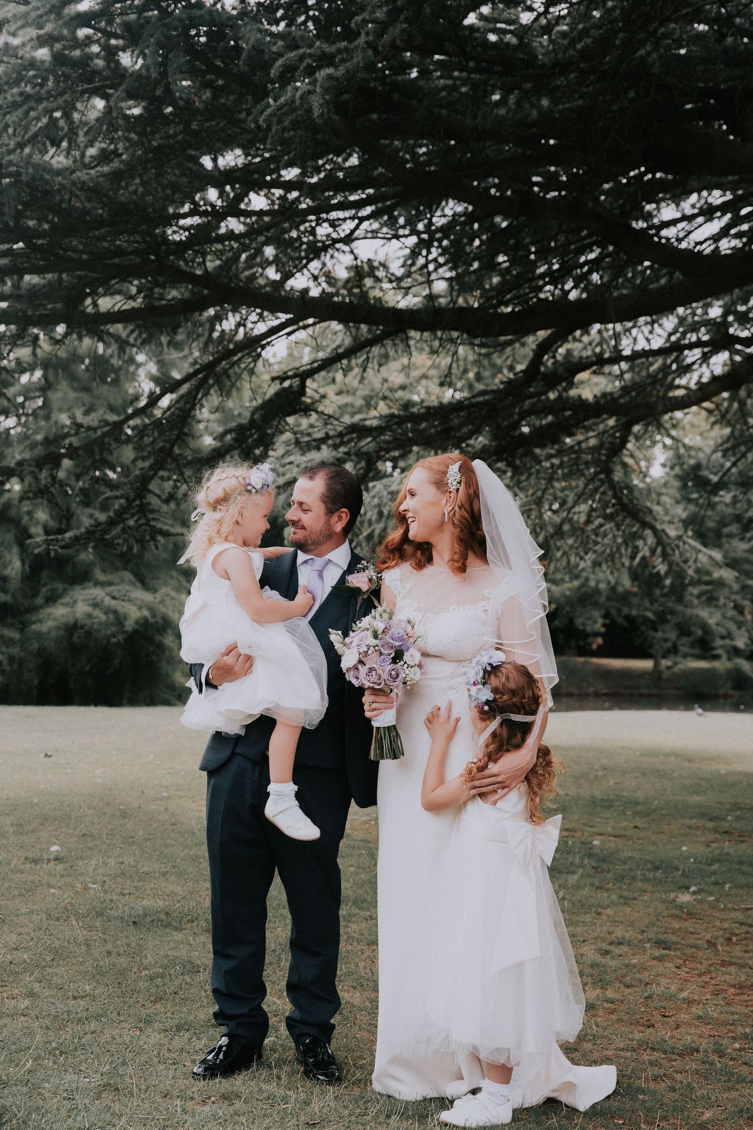 Beautiful family photo of bride and groom with children at langtons registry office, langtons house hornchurch wedding photography,